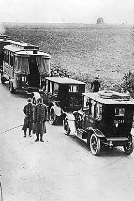 This historical photo shows taxicabs lined up and waiting to go to the Marne battlefront in World War I