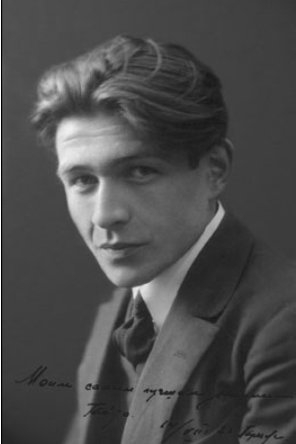 Portrait photo of author Gaito Gazdenov in a suit and tie