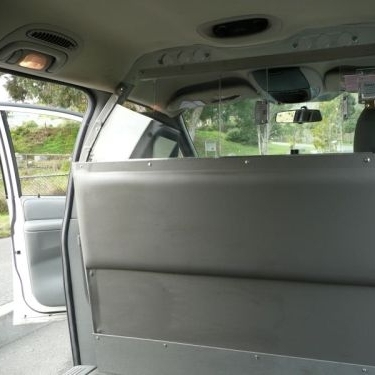Photo of a bullet-resistant partition in a minivan taxicab